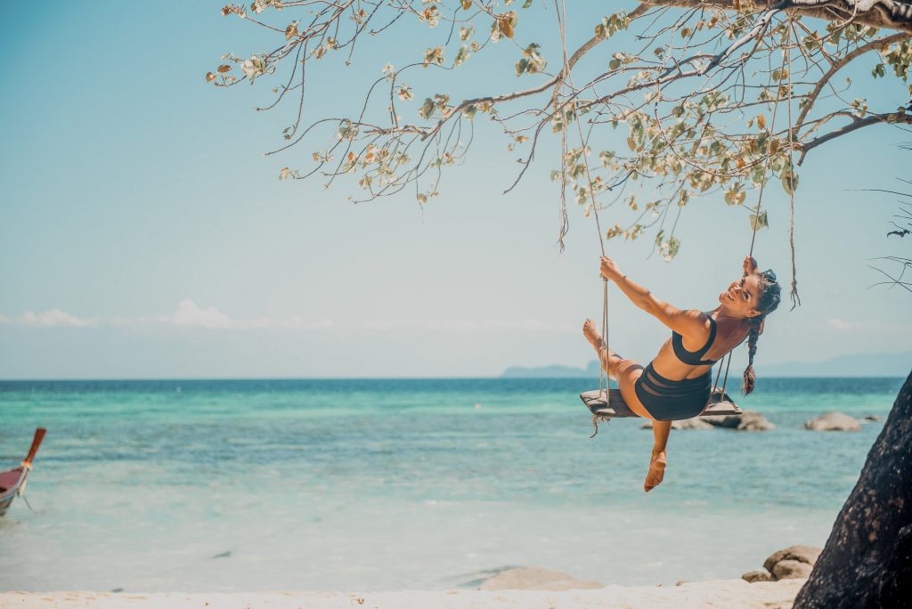 Annie Miller on a swing on Sunrise beach in Koh Lipe