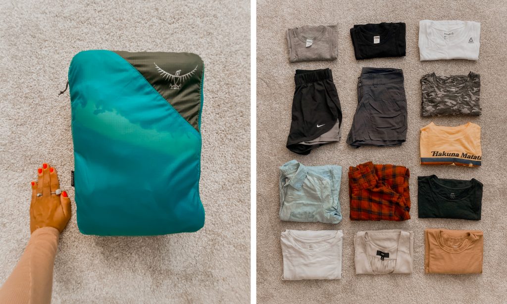large teal packing cube and items for world travels