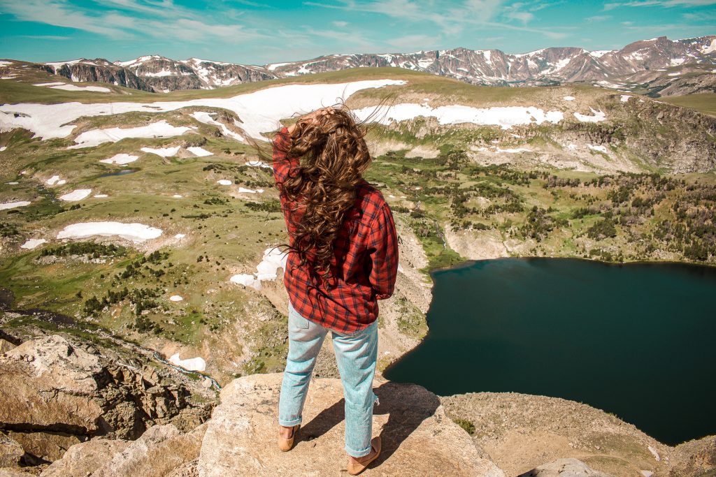 Annie Miller overlooking a lake on Beartooth Hwy Rt 212 - National Parks tour