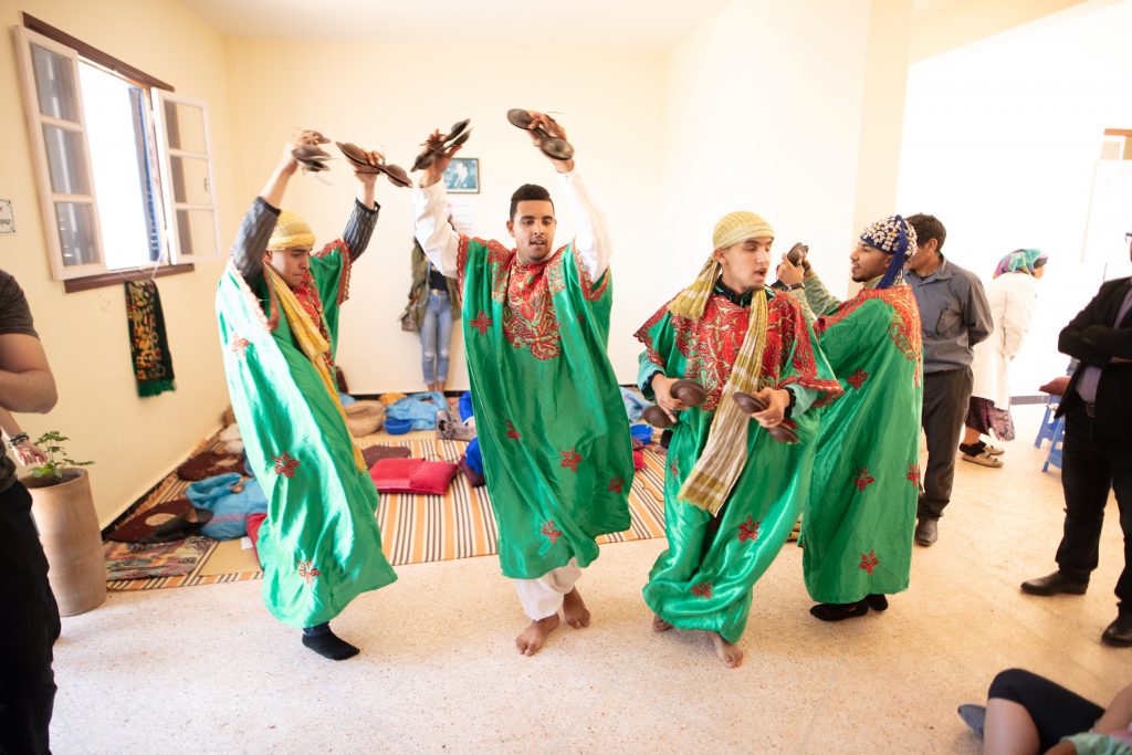 Men doing Traditional Moroccan dancing with FRÉ Skincare 