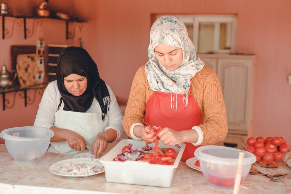 Moroccan women working with argan seeds for FRÉ Skincare