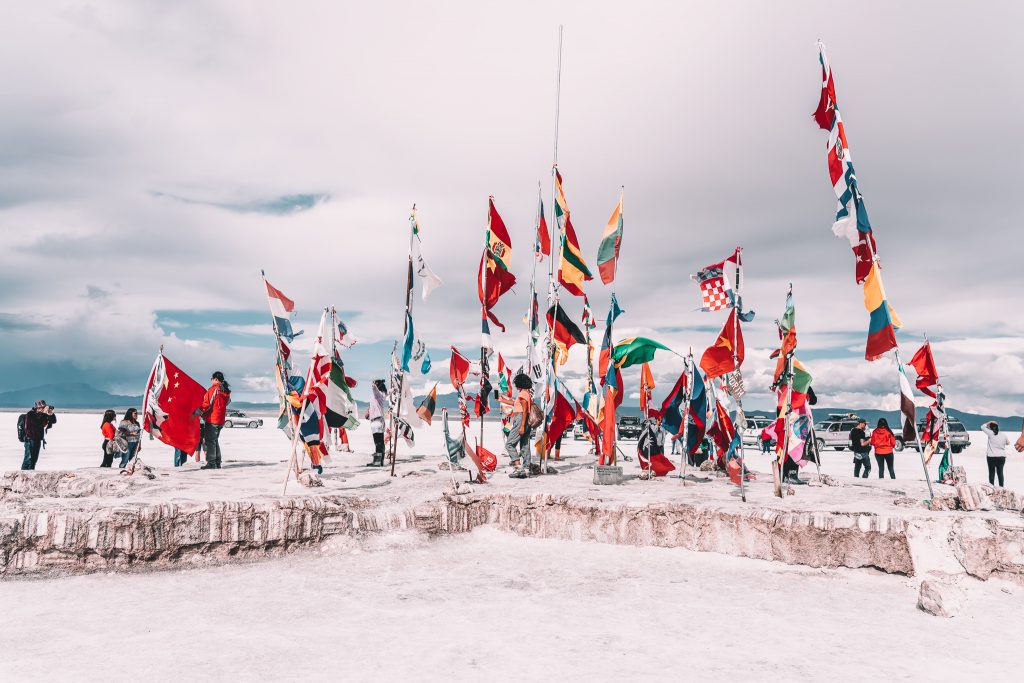 Flags from around the world in Uyuni at the salt monumnet