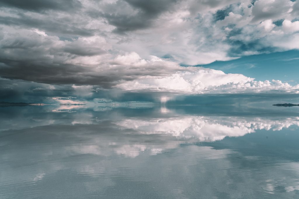 perfect reflection on the wet area of the Uyuni Salt Flats by Annie Miller