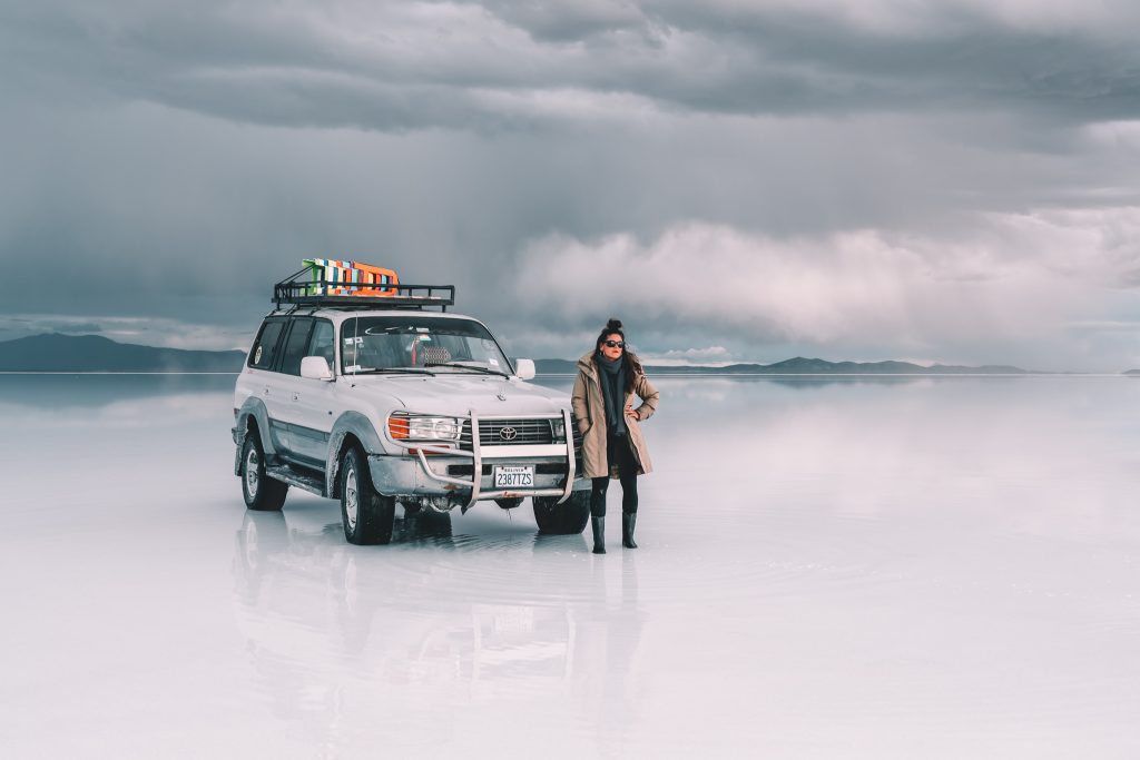 Annie Miller with the four runner on the wet area of the Salt Flats