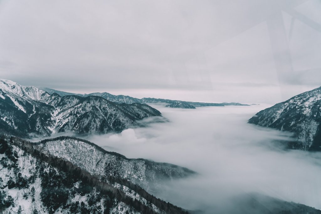Fog sitting over the Japanese Alps by Annie Miller